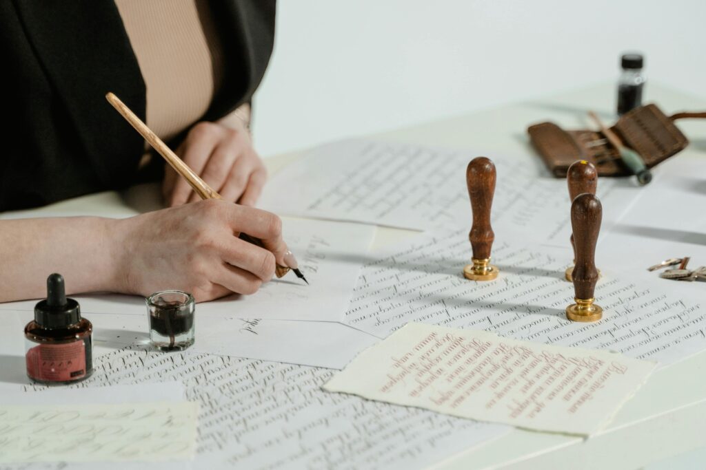 Artistic calligraphy writing with vintage seals and ink on paper.